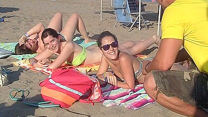Spanish chicks seduced on a beach